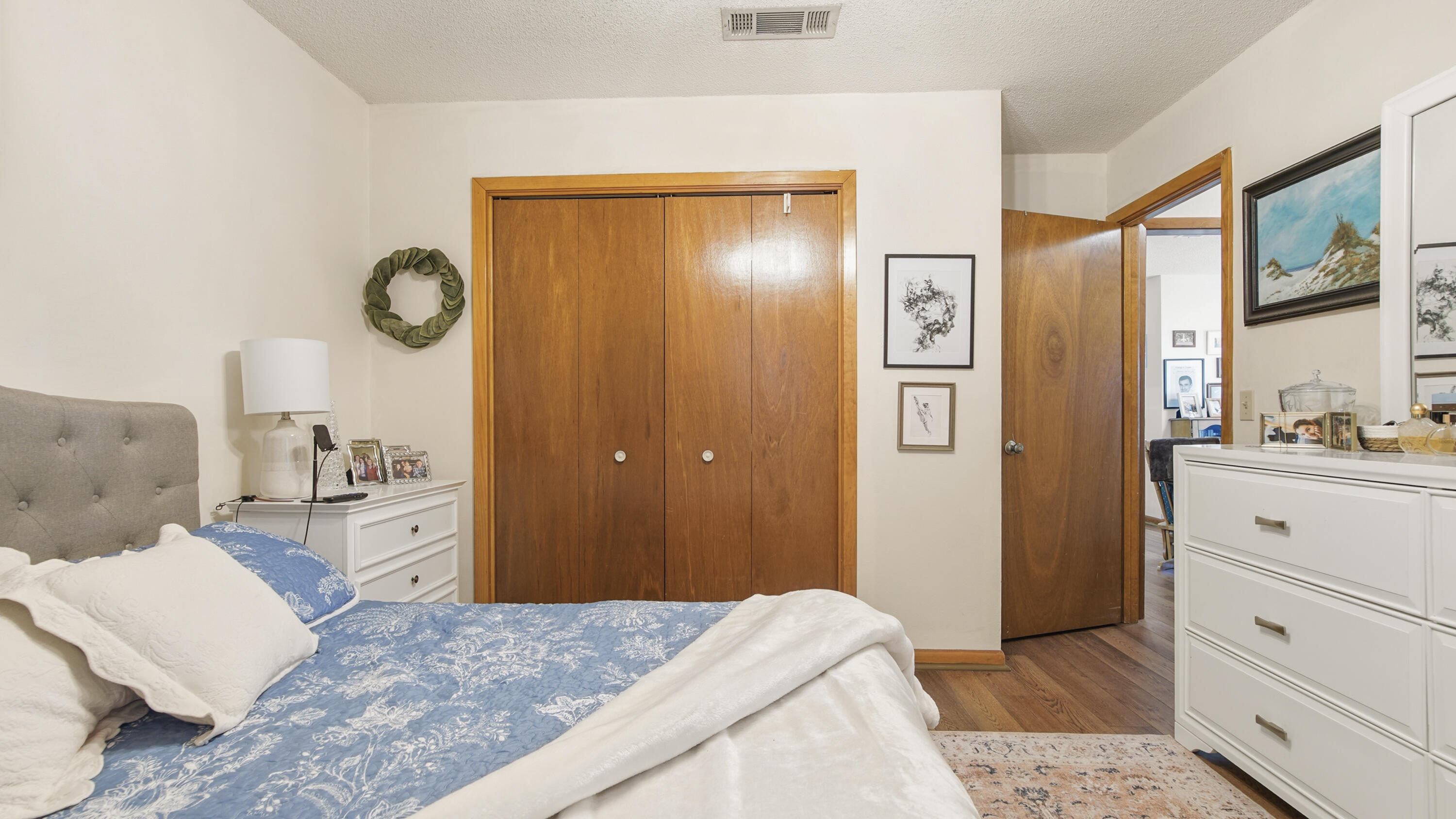 2186 Highway 90 DeFuniak Springs, FL 32433 - Photo 22 of 49 a bedroom with a bed and a dresser with mirror