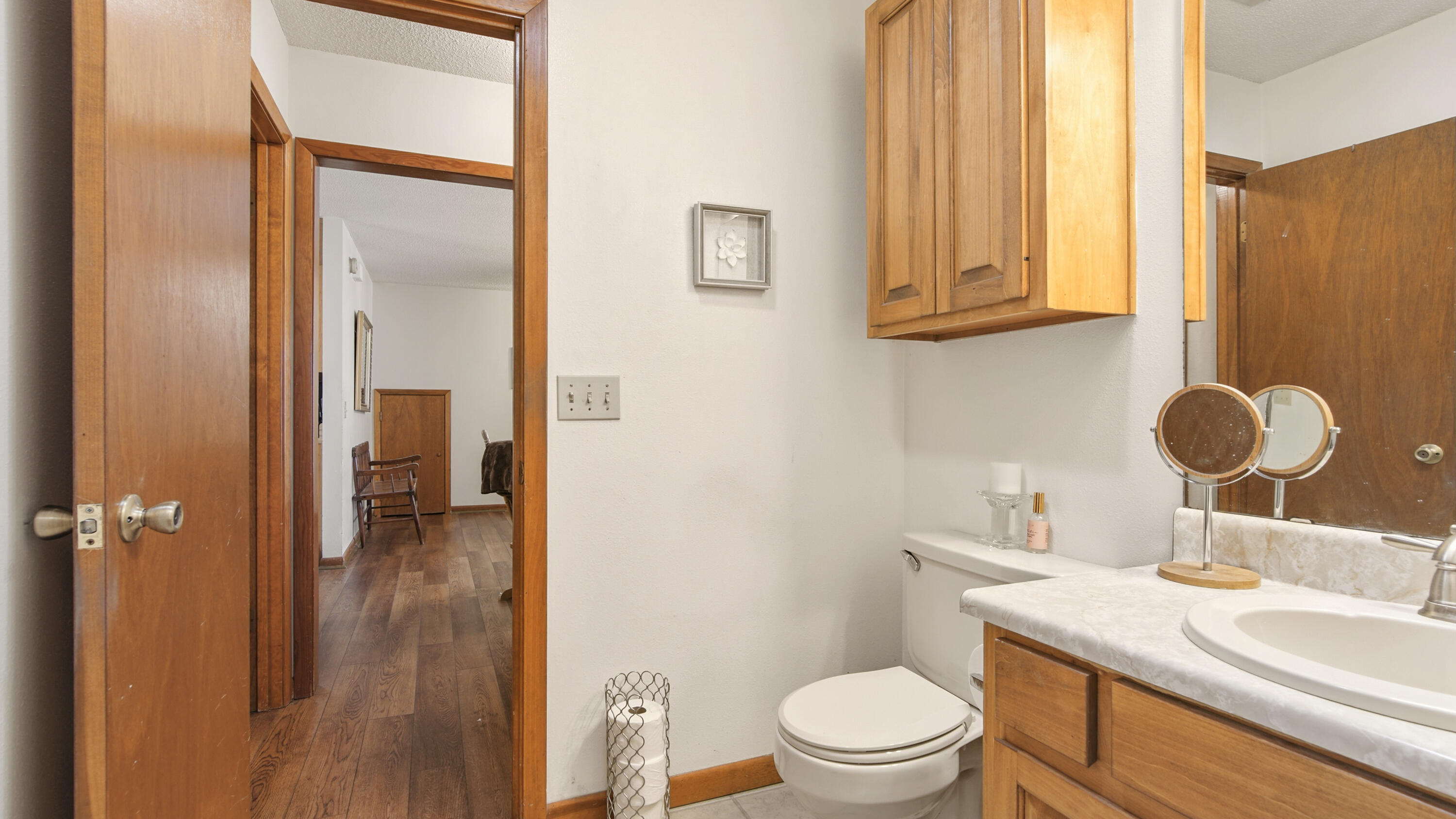 2186 Highway 90 DeFuniak Springs, FL 32433 - Photo 26 of 49 a bathroom with a granite countertop sink toilet and mirror