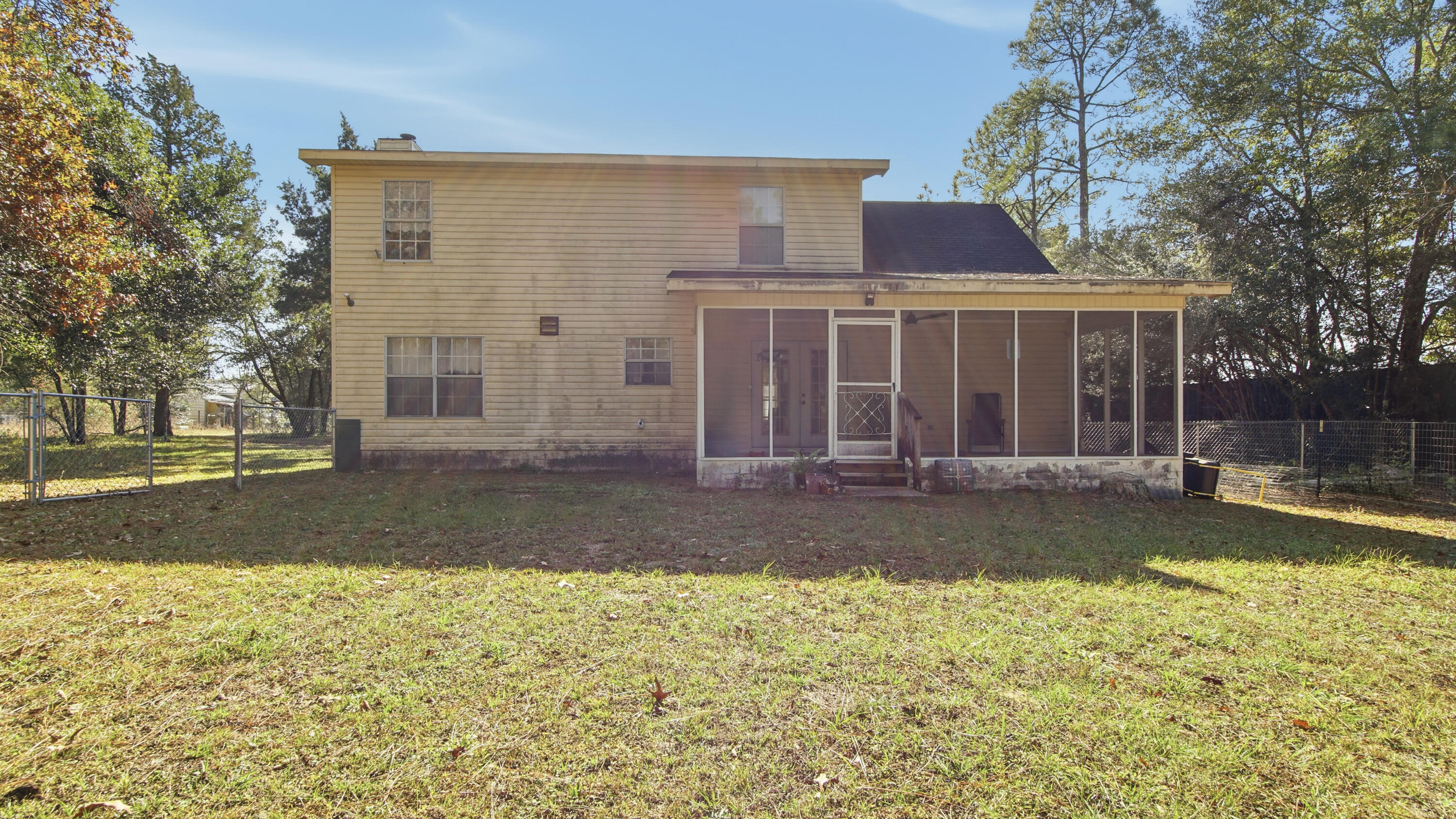 2186 Highway 90 DeFuniak Springs, FL 32433 - Photo 41 of 49 a view of a house with a yard and tree s