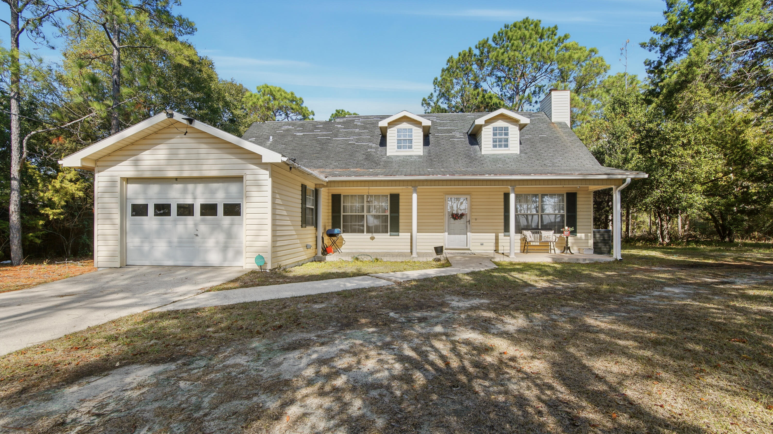 2186 Highway 90 DeFuniak Springs, FL 32433 - Photo 42 of 49 a front view of a house with a garden