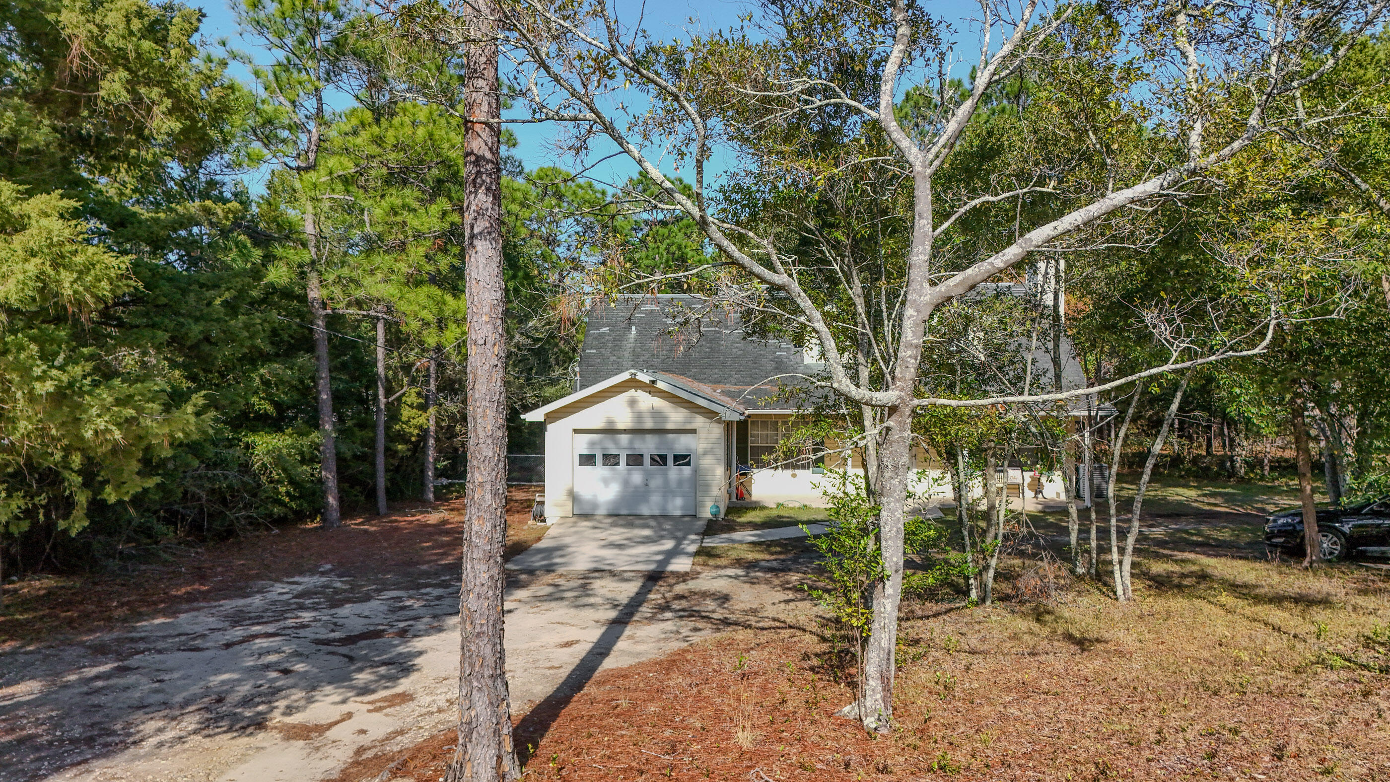 2186 Highway 90 DeFuniak Springs, FL 32433 - Photo 43 of 49 a view of a house with a yard
