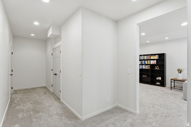 1712 Somerset Ridge Drive Draper, UT 84020 - Photo 55 of 76 Hallway with light gray carpeting, white walls, recessed lighting, and white baseboards