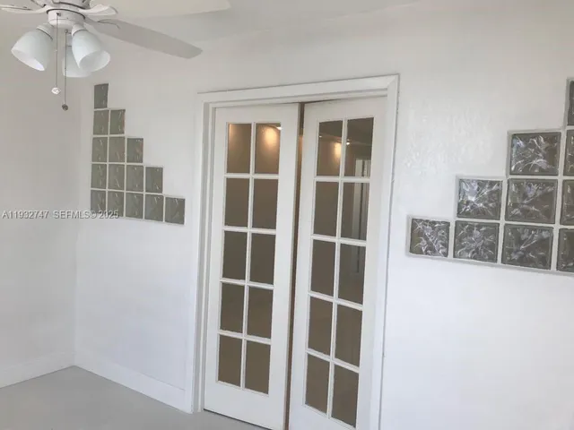 a view of a glass door with a mirror