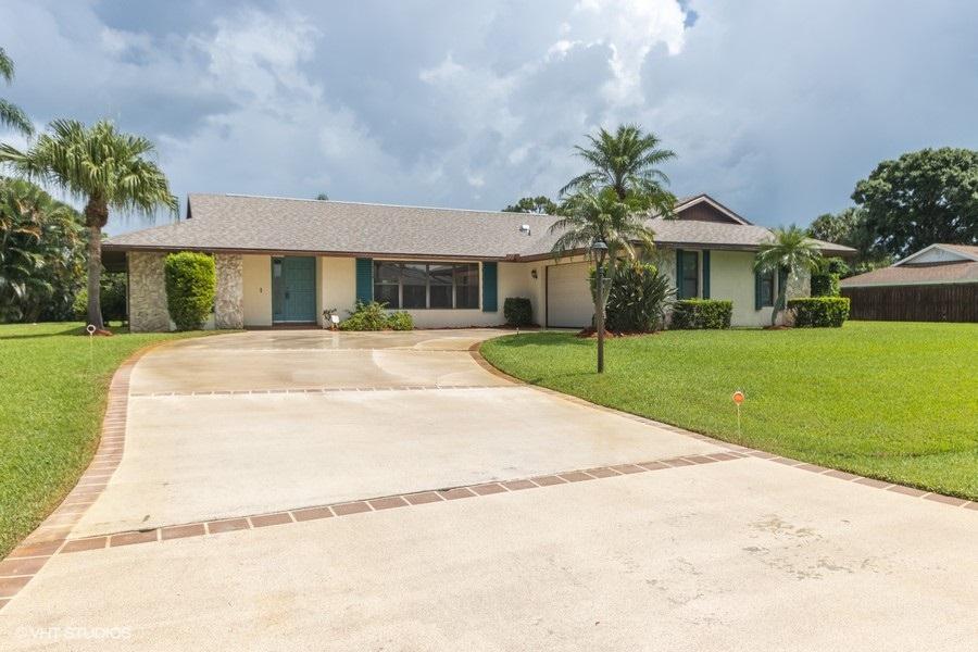2418 Southeast Issac Road Port St. Lucie, FL 34952 - Photo 1 of 25 02_2418SEIssacRd_2002_driveway