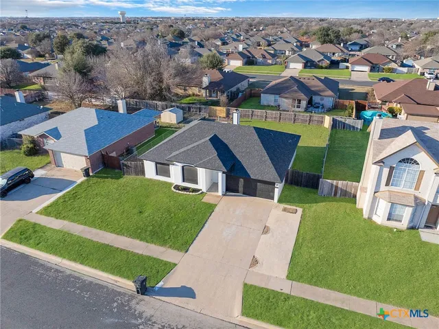 an aerial view of a house with a garden