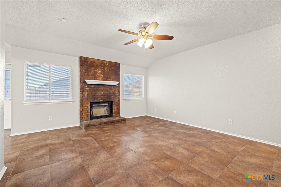 4215 Rifle Drive Killeen, TX 76542 - Photo 7 of 30 a view of an empty room with window and fireplace