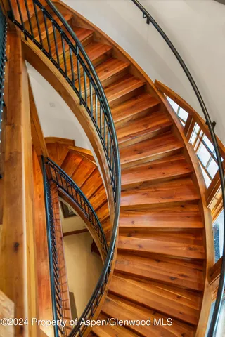 a living room with furniture and a ceiling fan