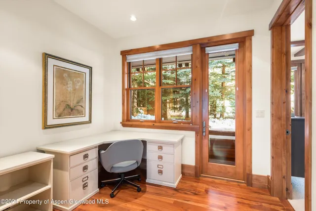 a view of a livingroom with furniture and windows