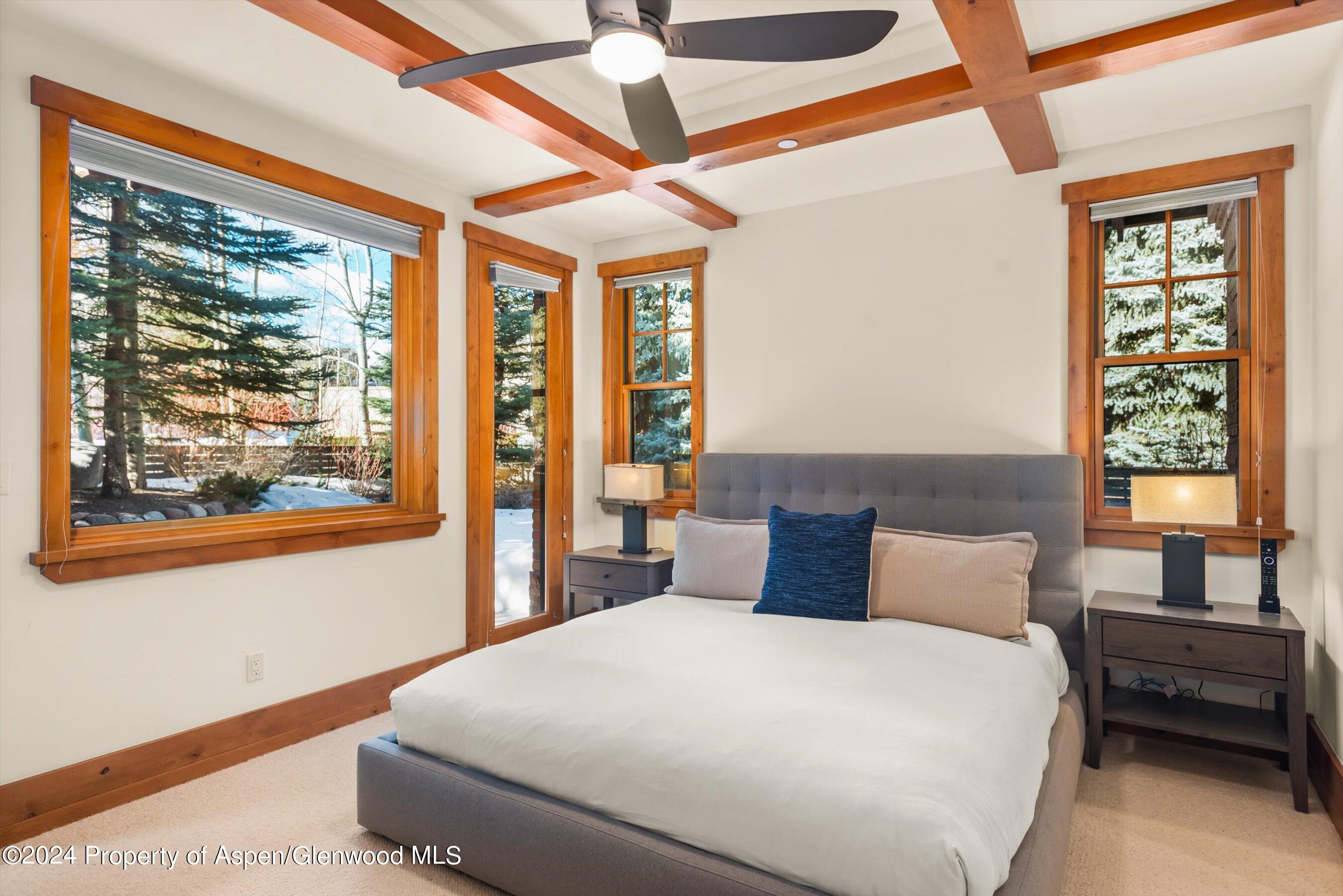 101 South 7th Street, Unit A Aspen, CO 81611 - Photo 7 of 35 a bedroom with a large bed and a window