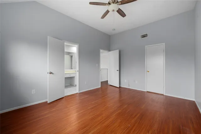 a view of a room with wooden floor