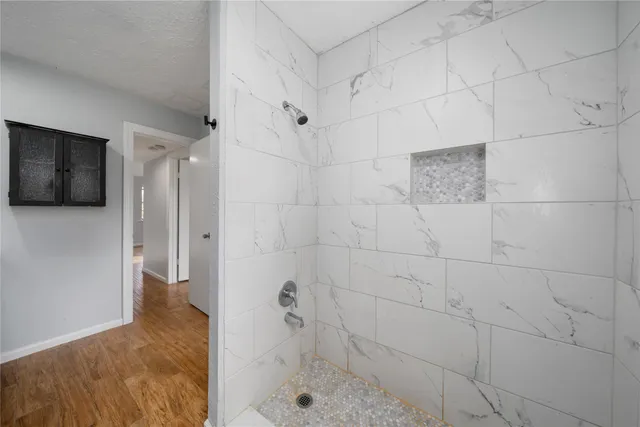 a view of a backyard with wooden fence