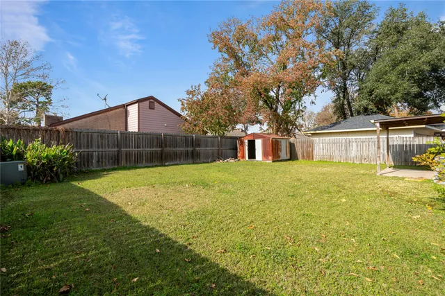 a front view of house with deck and yard