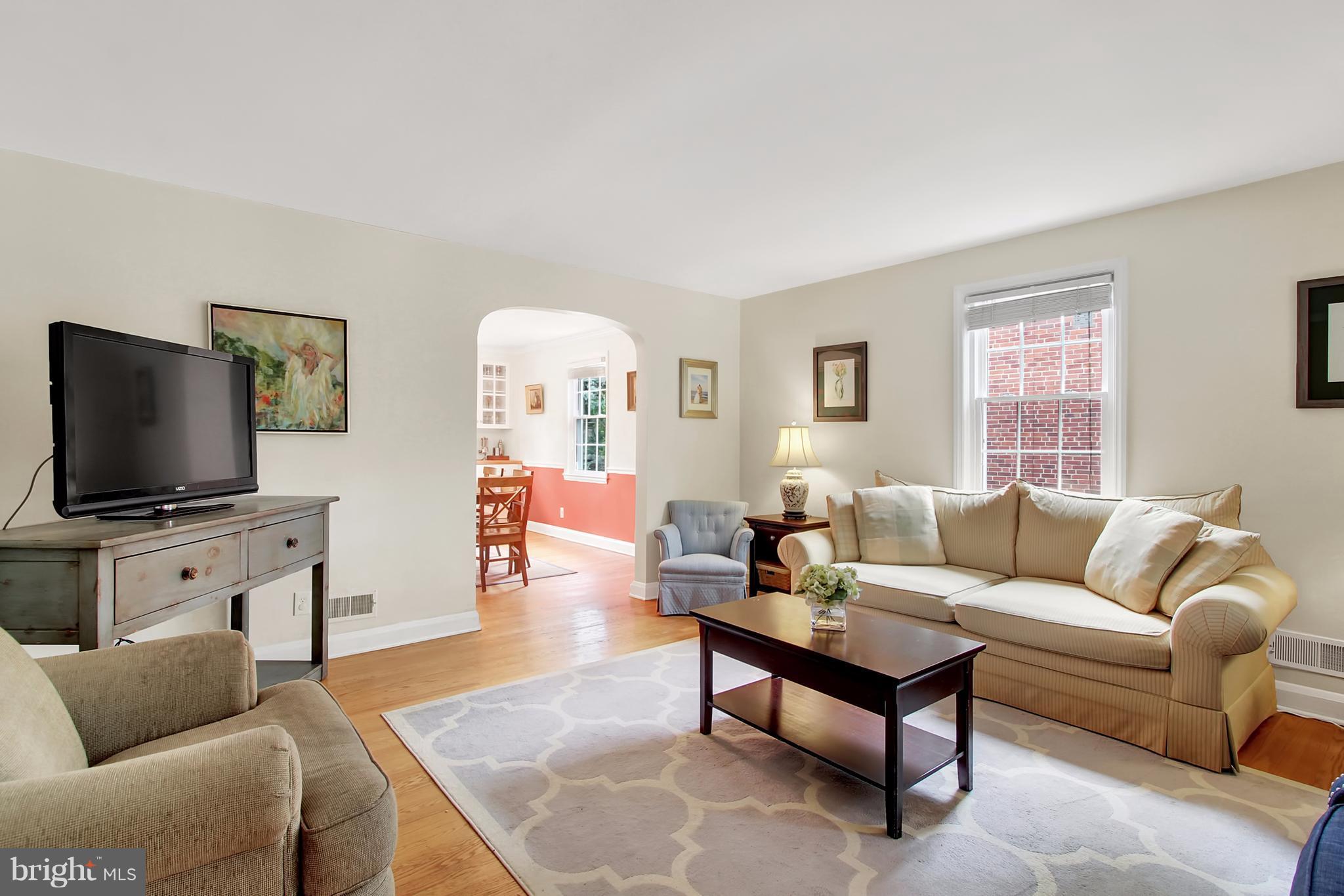 150 Dumbarton Road Baltimore, MD 21212 - Photo 1 of 30 a living room with furniture and a flat screen tv