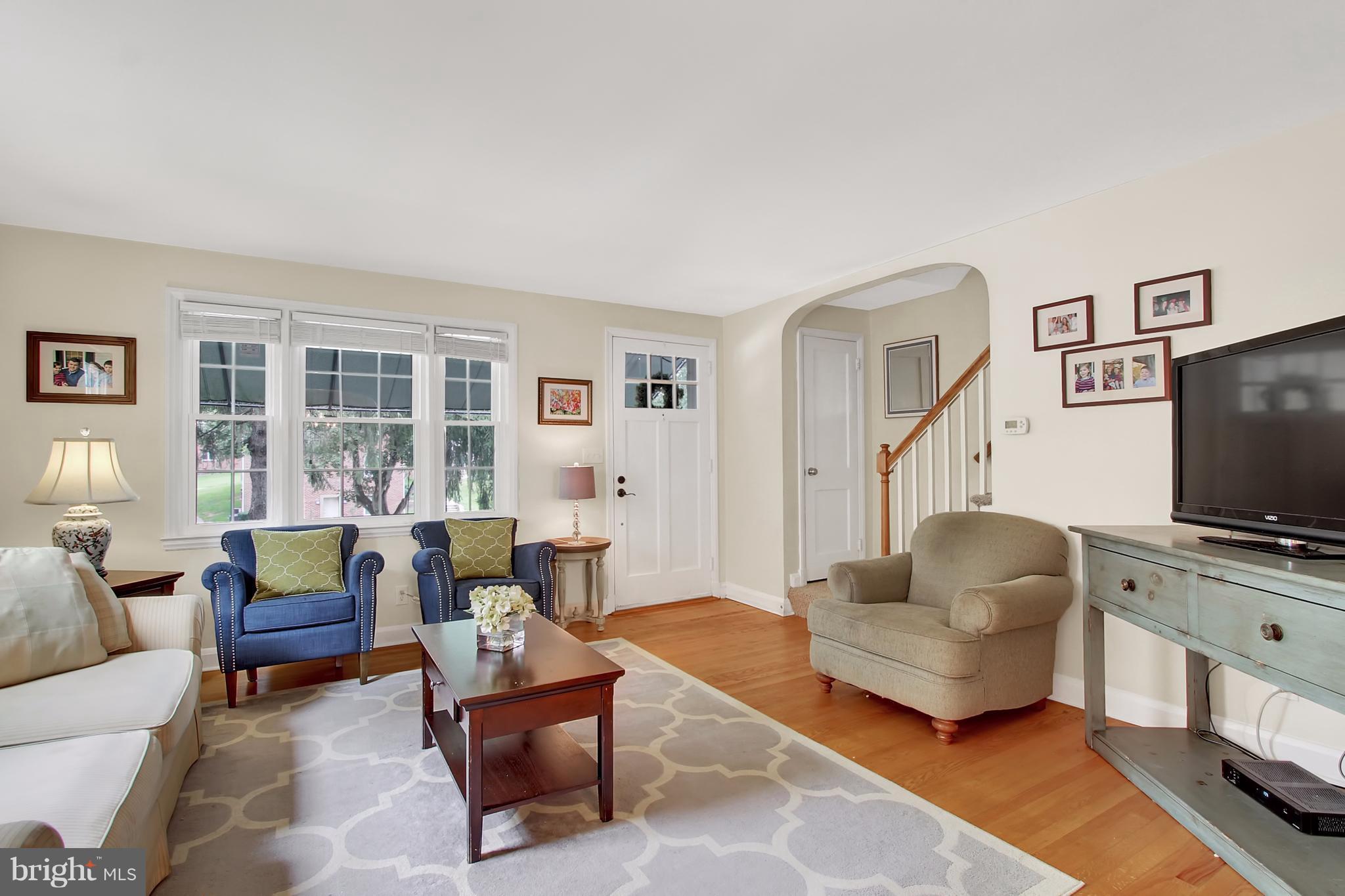 150 Dumbarton Road Baltimore, MD 21212 - Photo 2 of 30 a living room with furniture and a flat screen tv