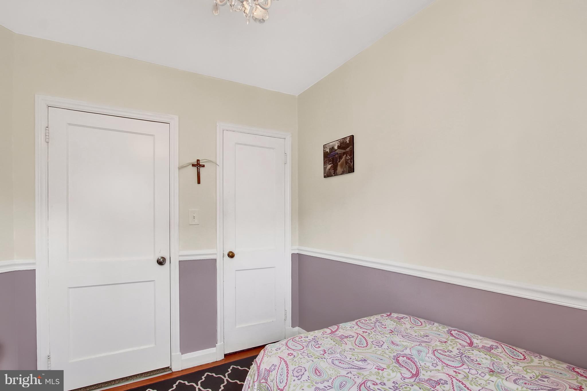 150 Dumbarton Road Baltimore, MD 21212 - Photo 15 of 30 a bedroom with a bed and a window