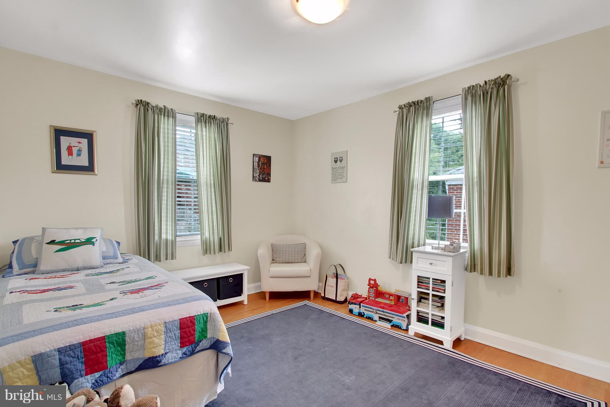 150 Dumbarton Road Baltimore, MD 21212 - Photo 16 of 30 a bedroom with a bed and a window