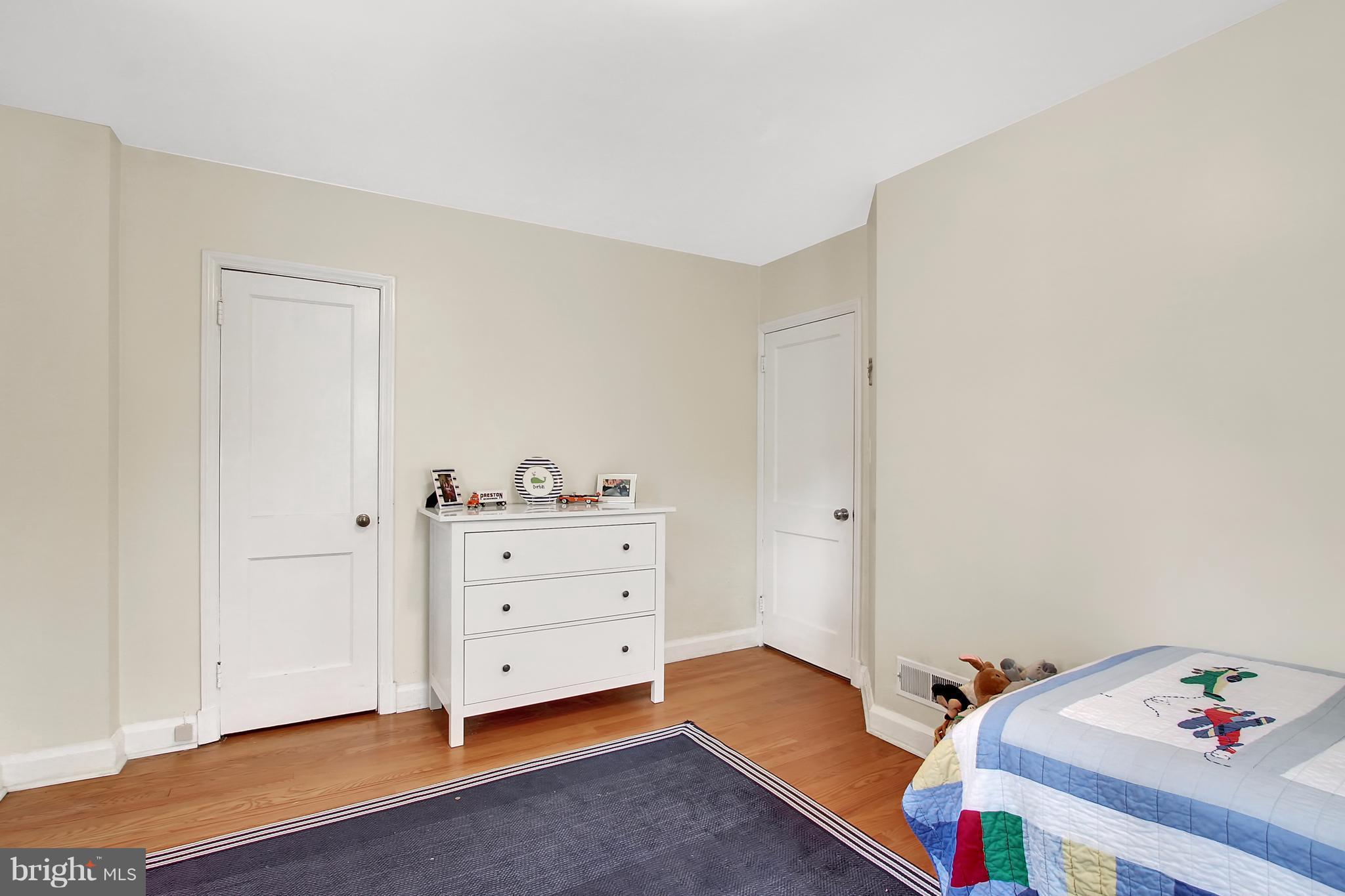 150 Dumbarton Road Baltimore, MD 21212 - Photo 17 of 30 a room with a baby bed baby crib and a dresser