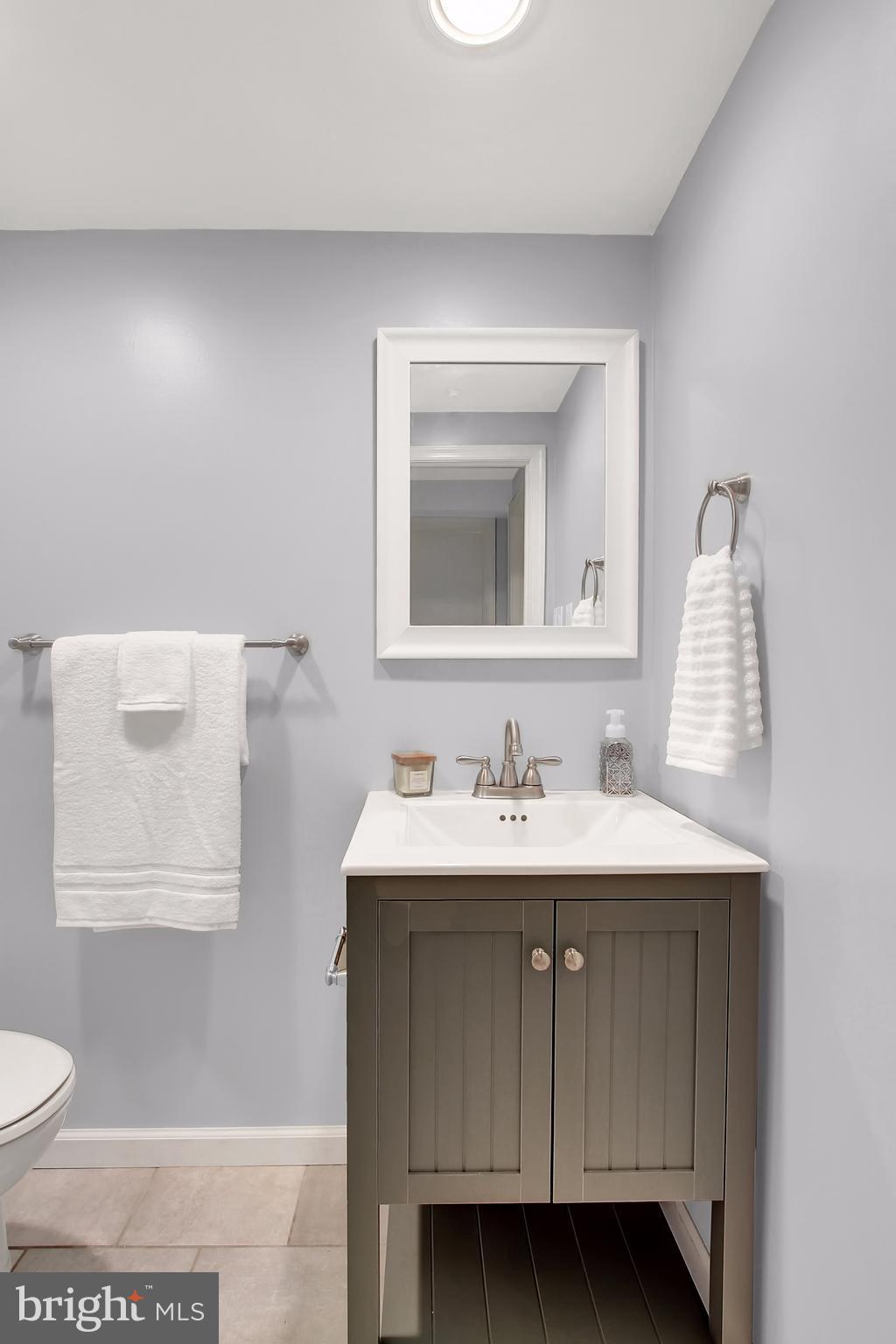 150 Dumbarton Road Baltimore, MD 21212 - Photo 21 of 30 a bathroom with a toilet sink and mirror
