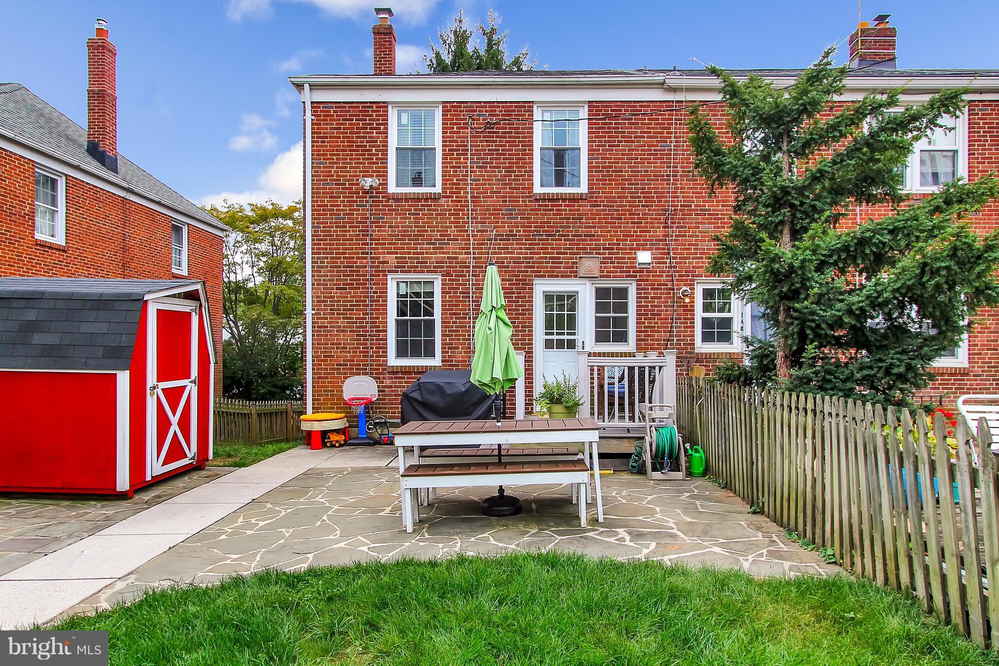 150 Dumbarton Road Baltimore, MD 21212 - Photo 24 of 30 a house with a bench in front of it