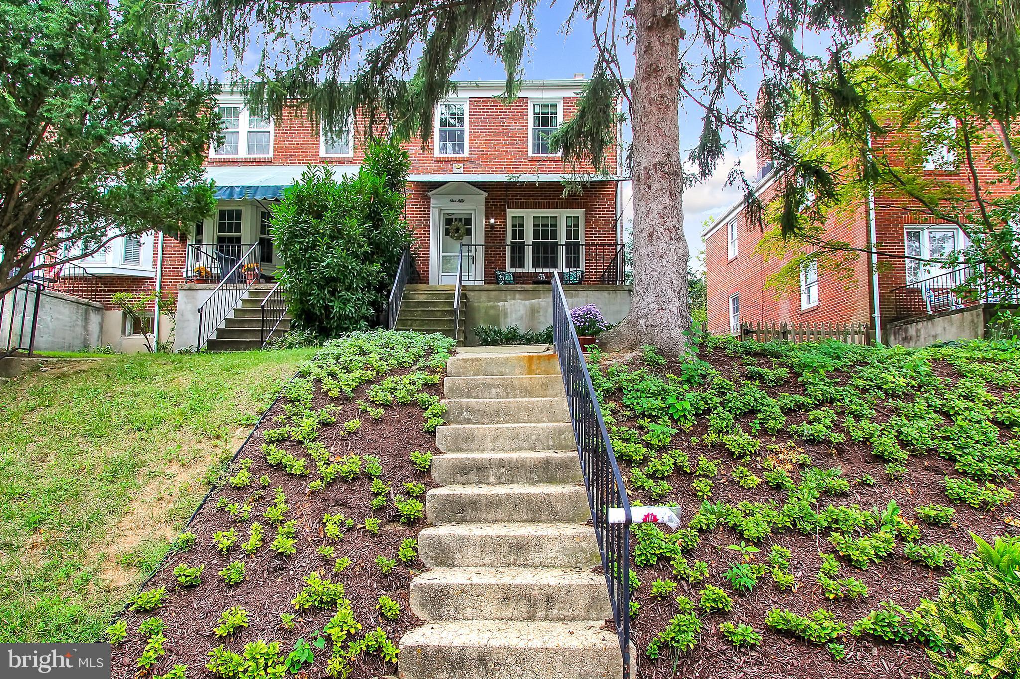 150 Dumbarton Road Baltimore, MD 21212 - Photo 29 of 30 a front view of a house with a yard and trees