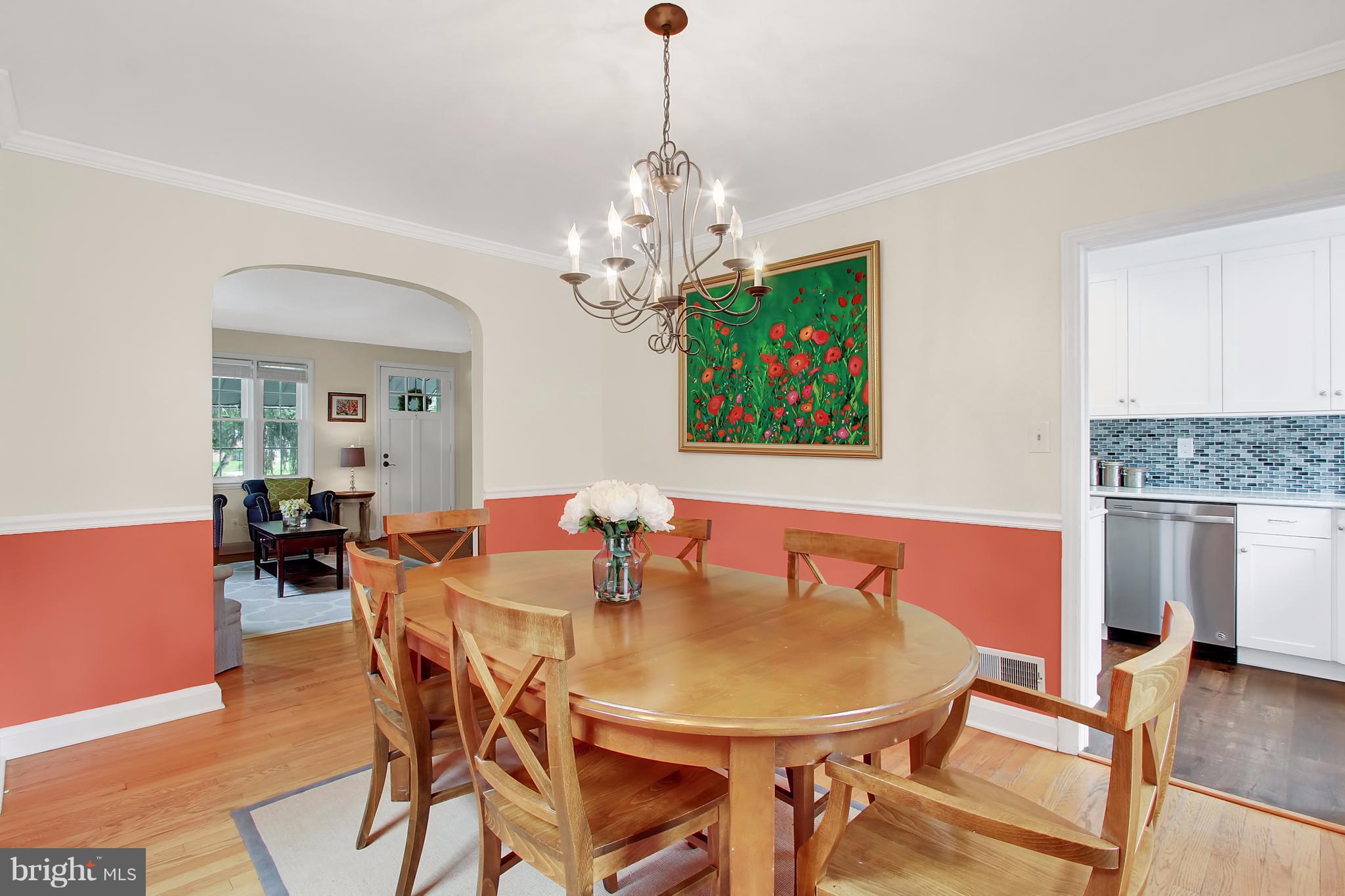 150 Dumbarton Road Baltimore, MD 21212 - Photo 6 of 30 a view of a dining room with furniture wooden floor and chandelier