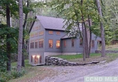 35 Bird Lane Copake, NY 12516 - Photo 3 of 9 a front view of a house with garden