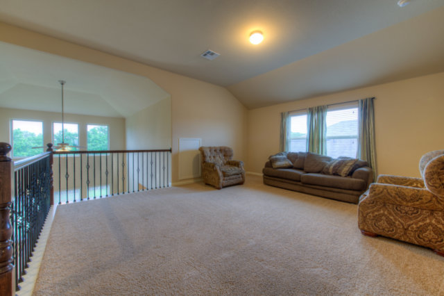 198 Stone View Trail Austin, TX 78737 - Photo 8 of 10 a living room with furniture a lamp and a chandelier