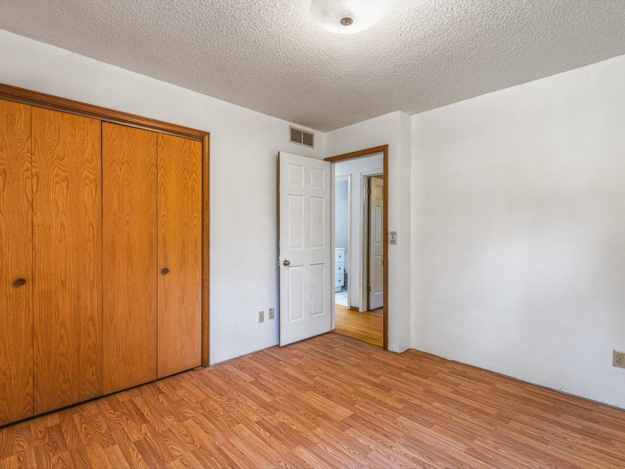 3621 Baxter Road Rockford, IL 61109 - Photo 17 of 56 a view of a room with wooden floor and bathroom