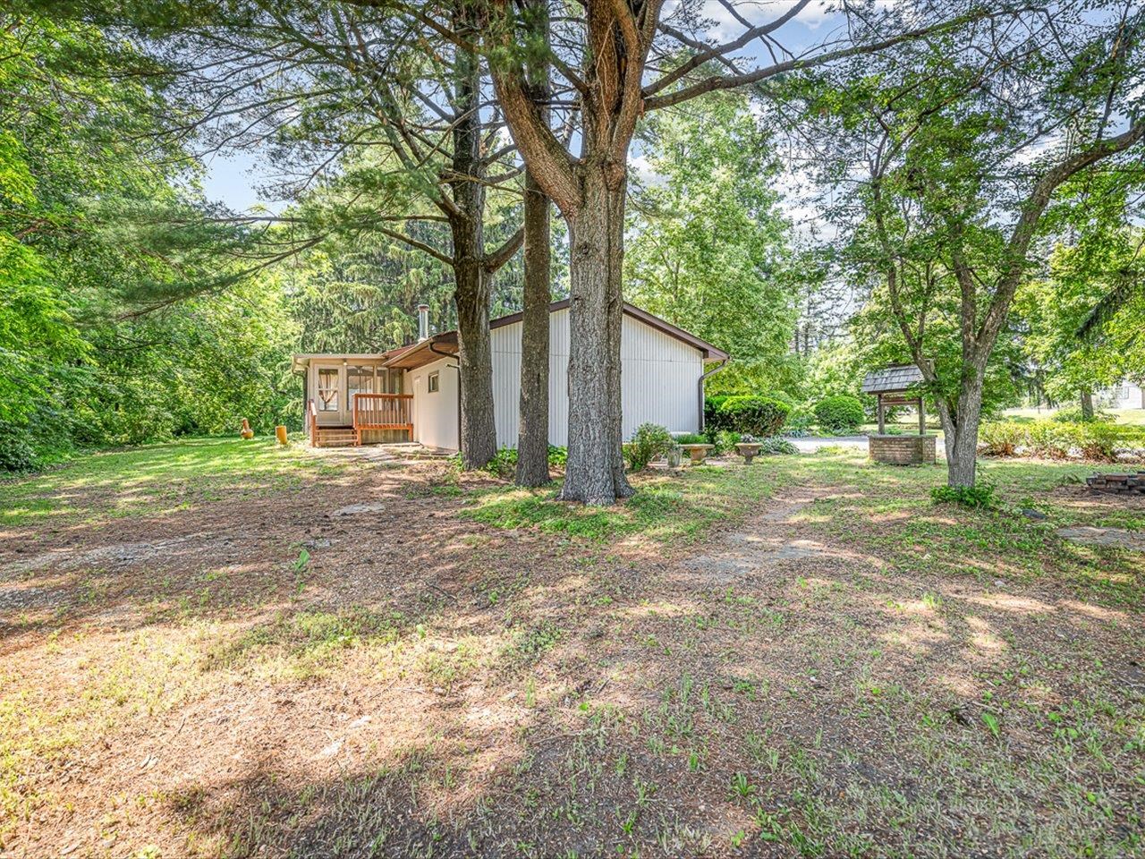 3621 Baxter Road Rockford, IL 61109 - Photo 33 of 56 a view of a house with backyard and trees