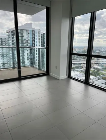 a view of an empty room with a large window