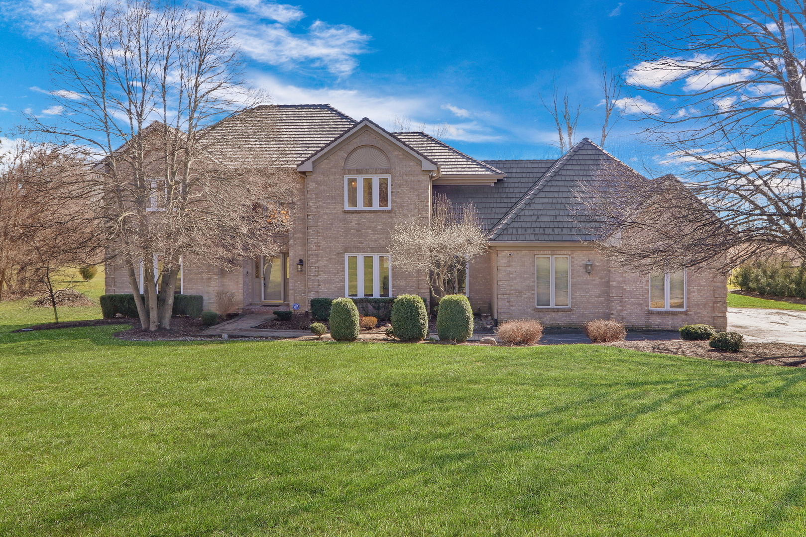 6881 September Boulevard Long Grove, IL 60047 - Photo 1 of 64 a view of a house with a yard and sitting area