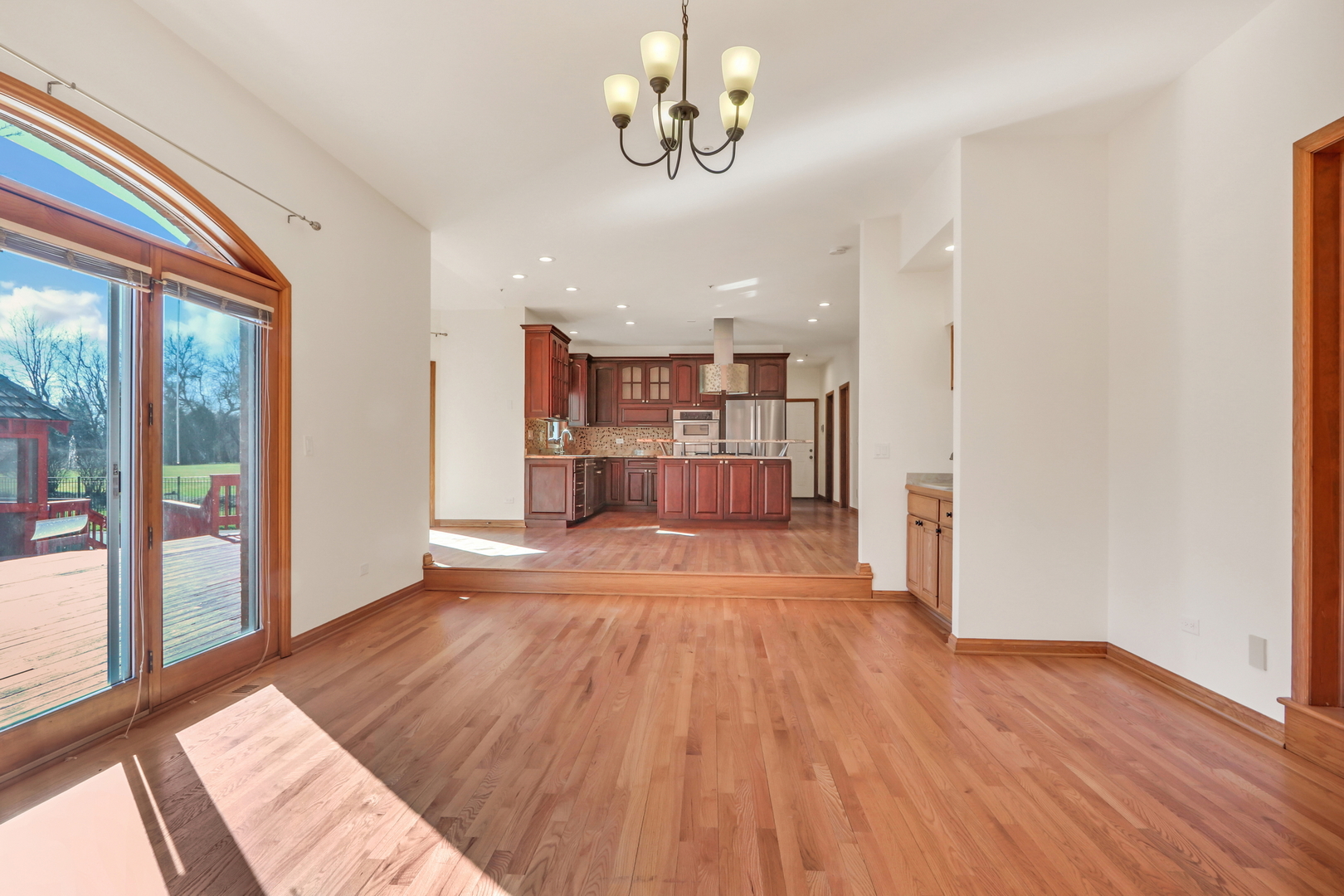 6881 September Boulevard Long Grove, IL 60047 - Photo 11 of 64 a view of a room with wooden floor and a window