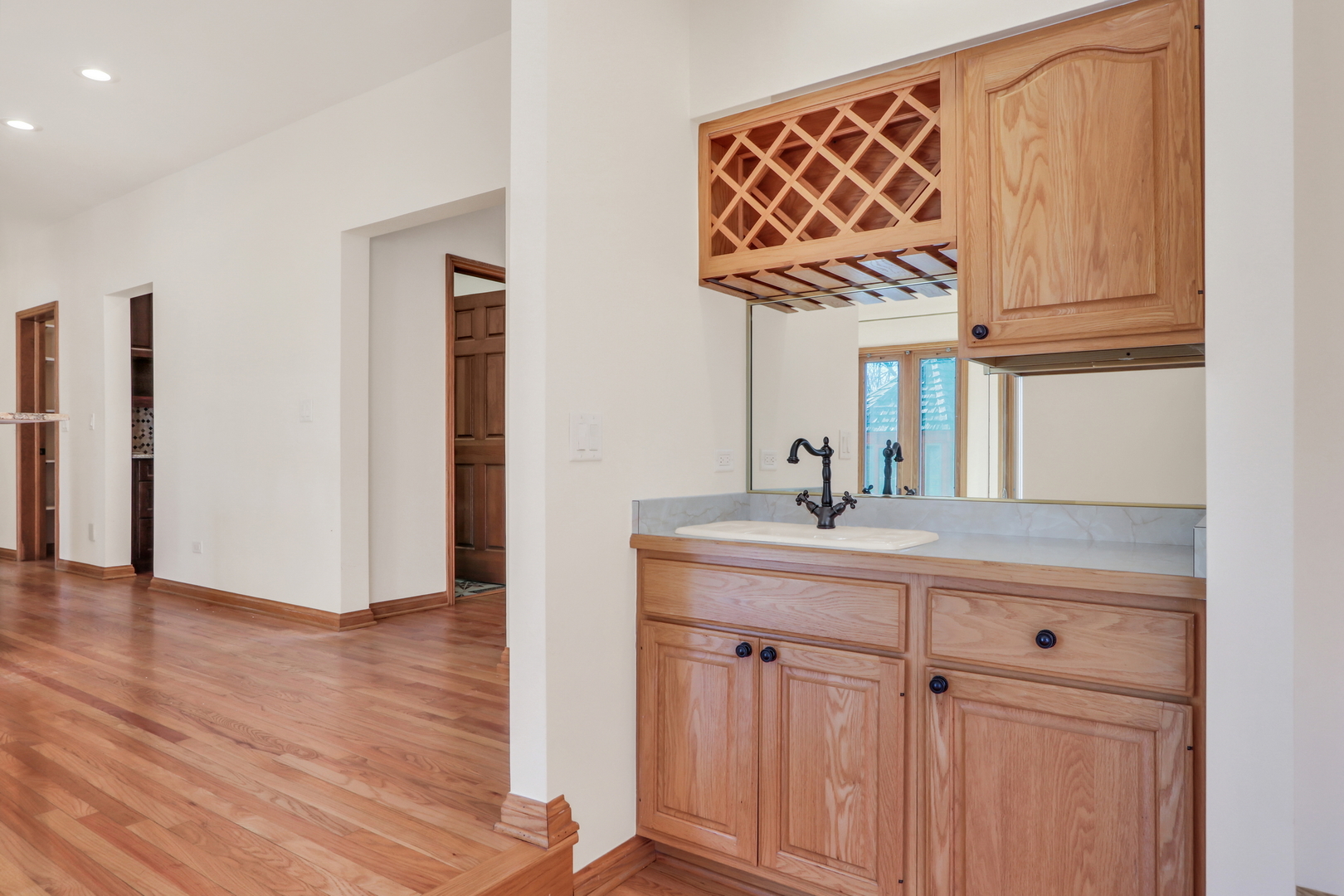 6881 September Boulevard Long Grove, IL 60047 - Photo 12 of 64 a kitchen with a sink and a refrigerator