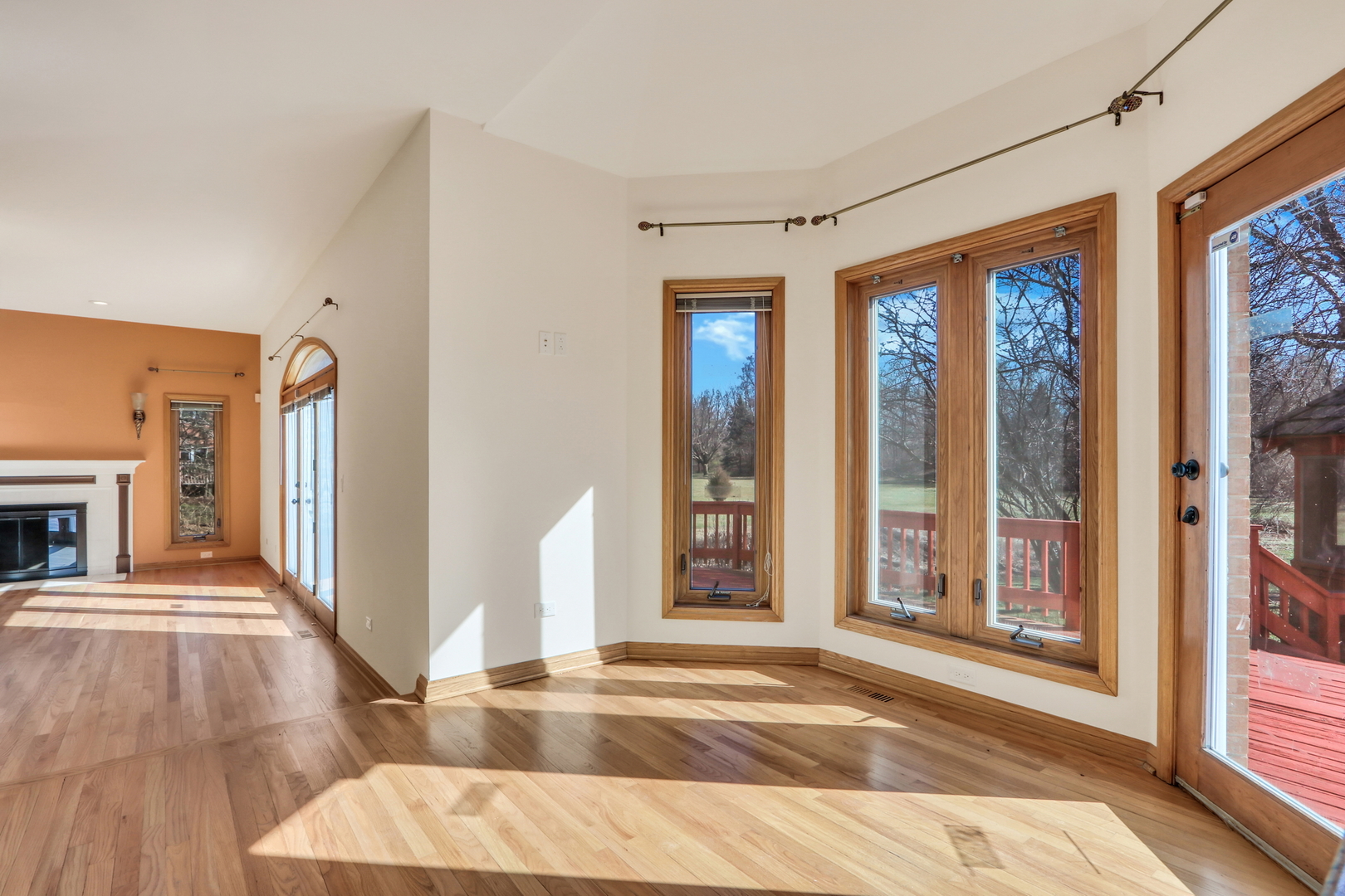 6881 September Boulevard Long Grove, IL 60047 - Photo 15 of 64 a view of a livingroom with wooden floor and a fireplace
