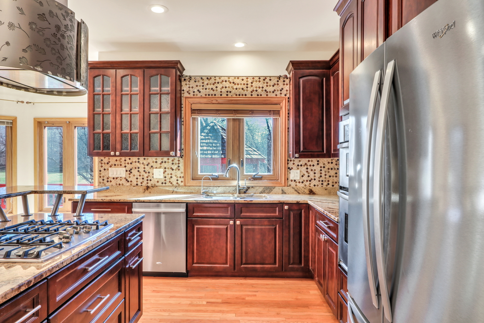 6881 September Boulevard Long Grove, IL 60047 - Photo 17 of 64 a kitchen with stainless steel appliances granite countertop a stove a sink dishwasher and a refrigerator