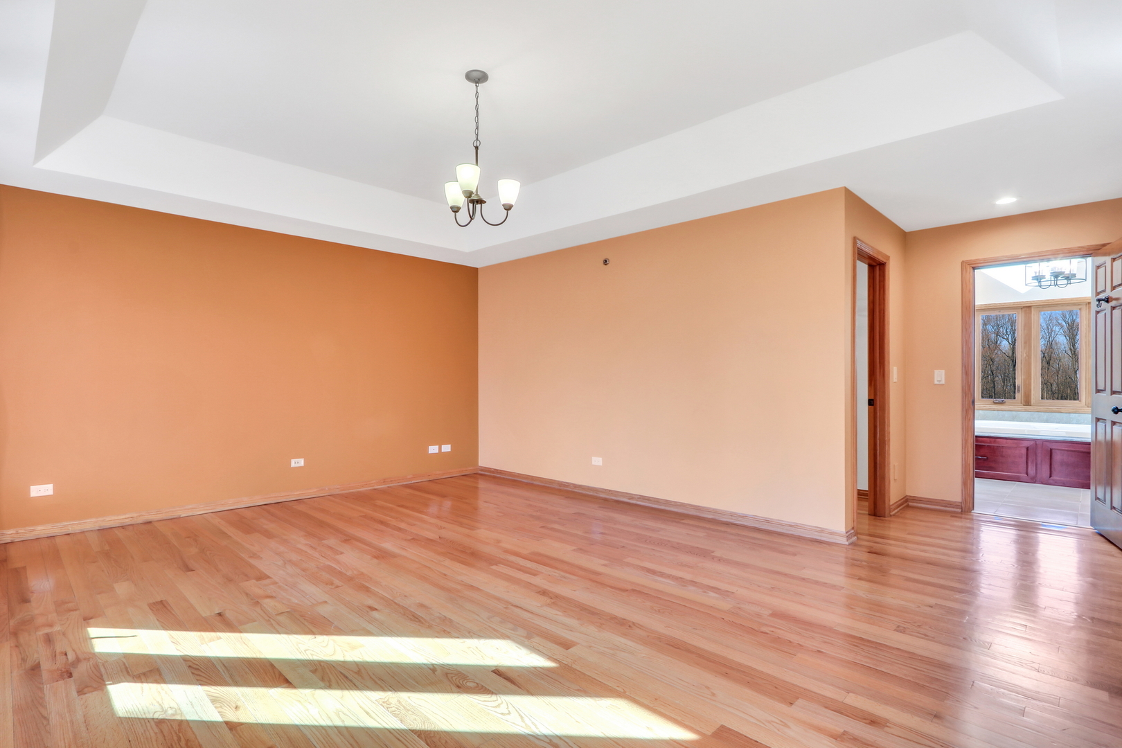 6881 September Boulevard Long Grove, IL 60047 - Photo 30 of 64 a view of livingroom with hardwood floor and kitchen view