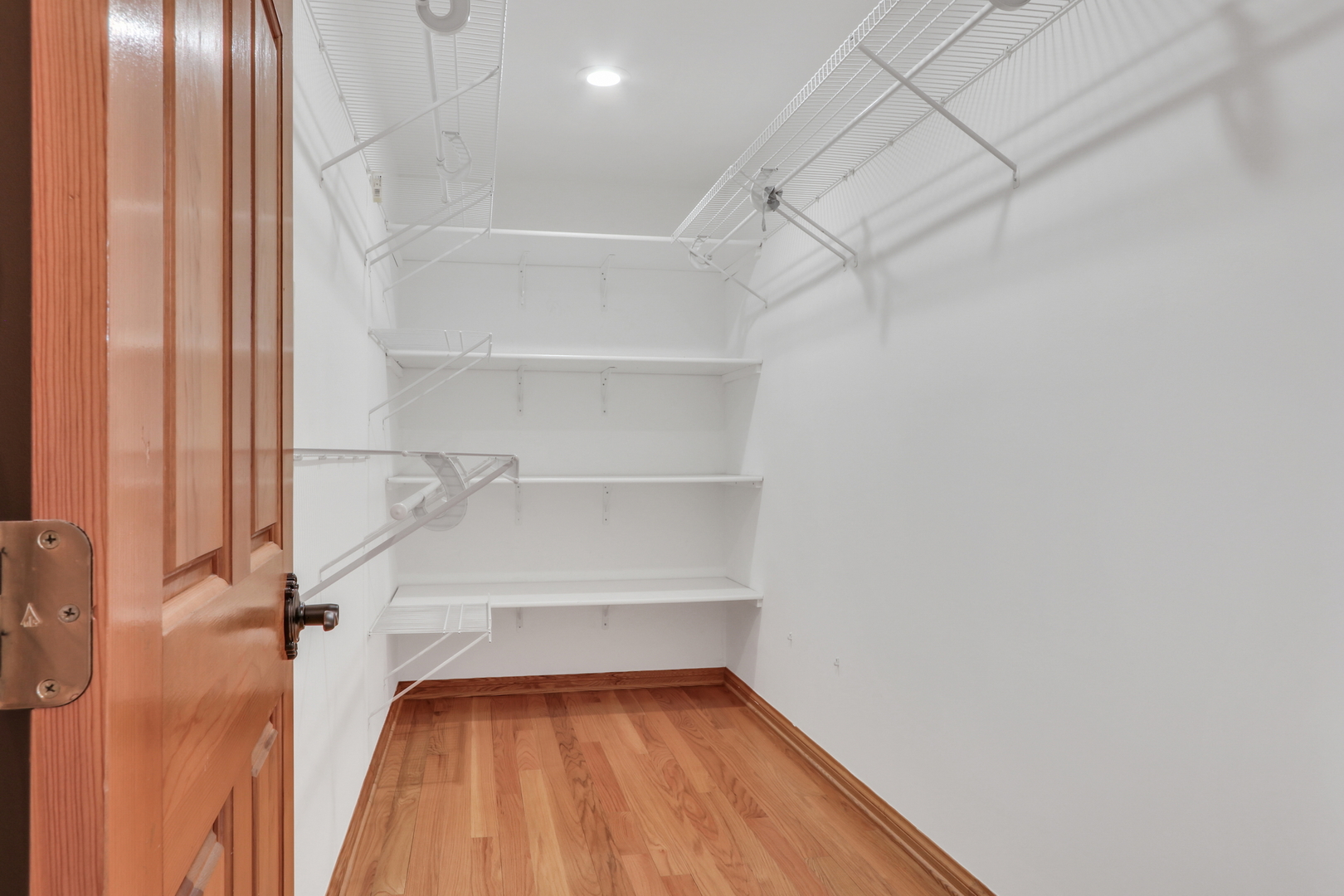 6881 September Boulevard Long Grove, IL 60047 - Photo 31 of 64 a view of a room with racks on the wall