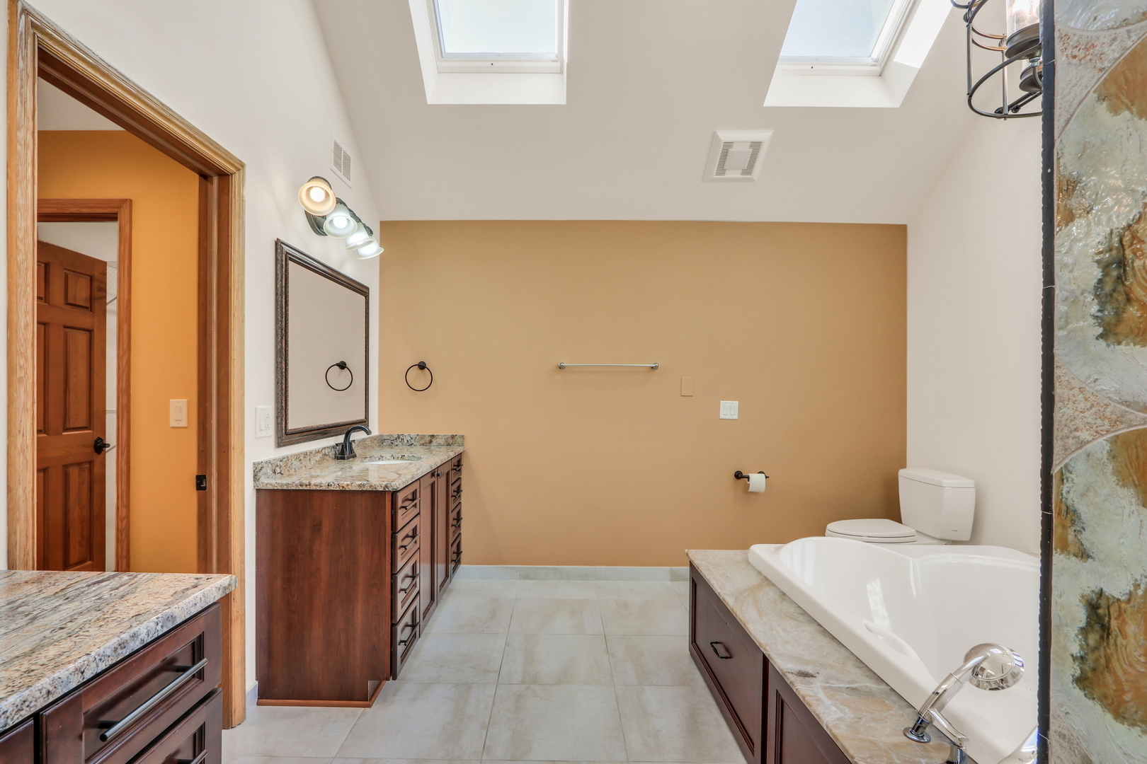 6881 September Boulevard Long Grove, IL 60047 - Photo 35 of 64 a bathroom with a sink a toilet and mirror