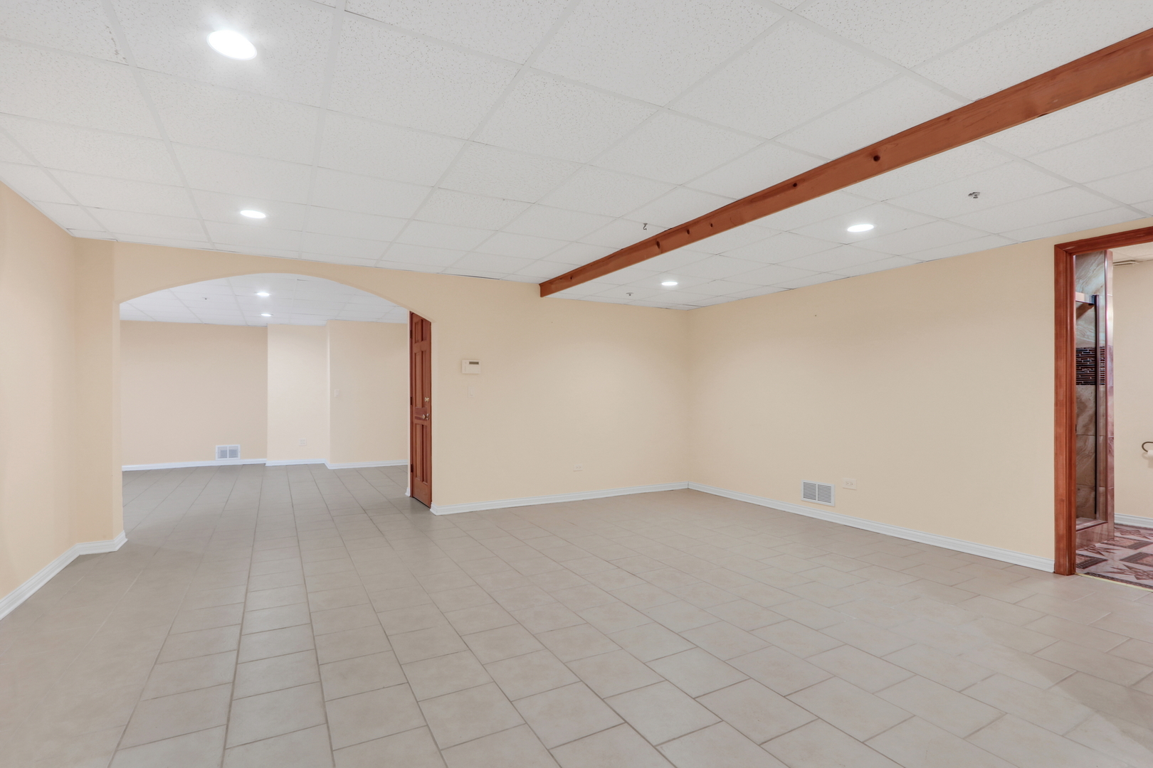 6881 September Boulevard Long Grove, IL 60047 - Photo 43 of 64 an empty room with white walls and tiles