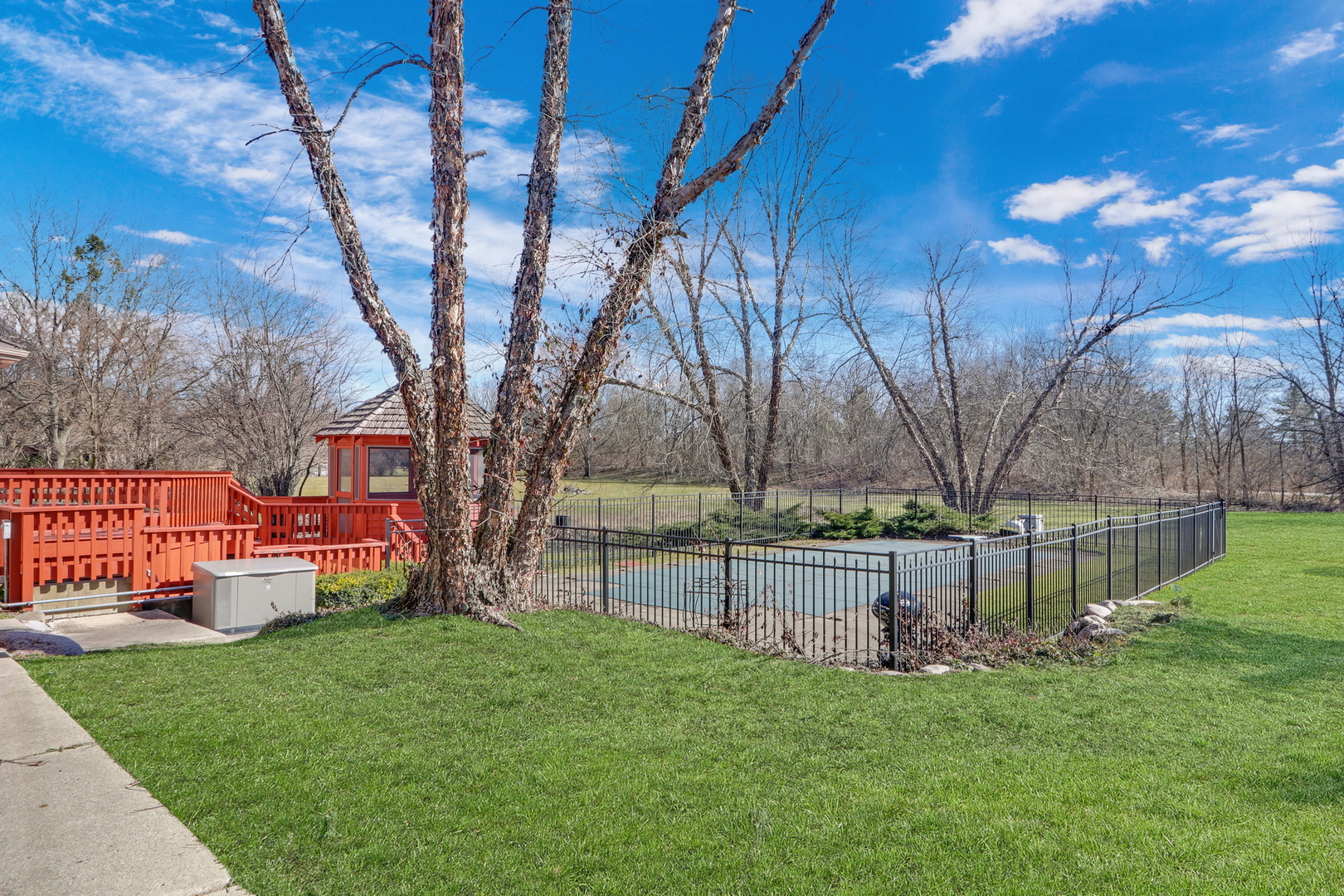 6881 September Boulevard Long Grove, IL 60047 - Photo 51 of 64 a view of backyard with table and chairs and wooden fence