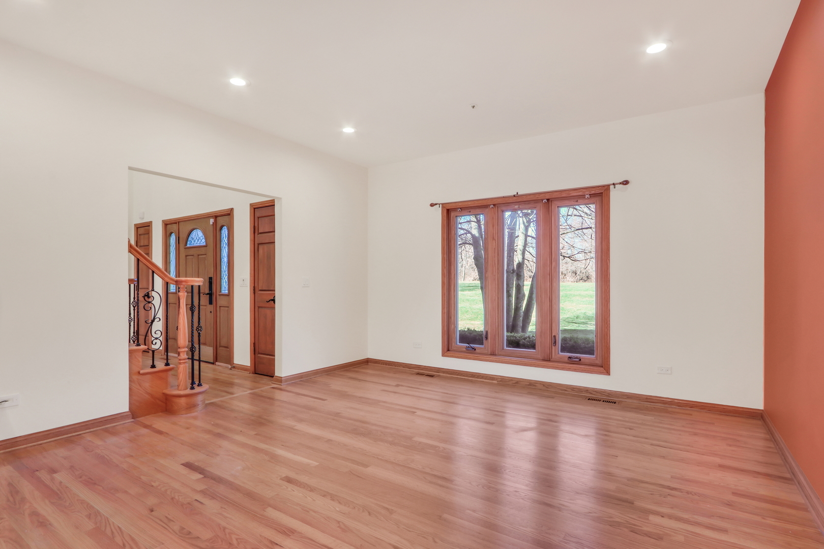 6881 September Boulevard Long Grove, IL 60047 - Photo 6 of 64 an empty room with wooden floor and windows