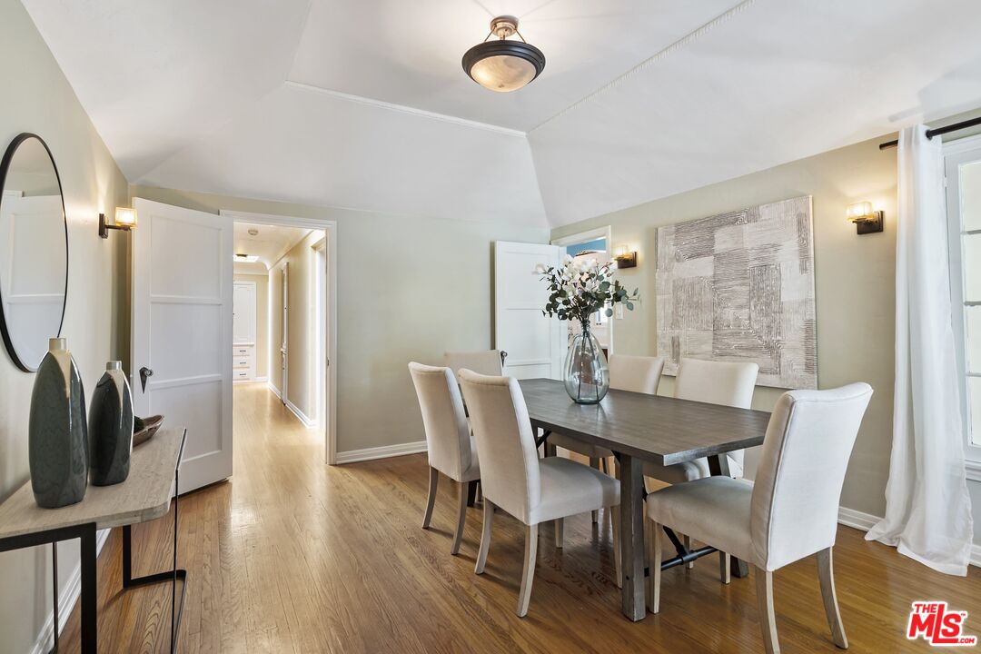 2303 Midvale Avenue Los Angeles, CA 90064 - Photo 12 of 38 a view of a dining room with furniture and wooden floor