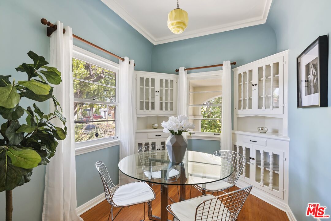 2303 Midvale Avenue Los Angeles, CA 90064 - Photo 15 of 38 a dining room with furniture a potted plant and a chandelier