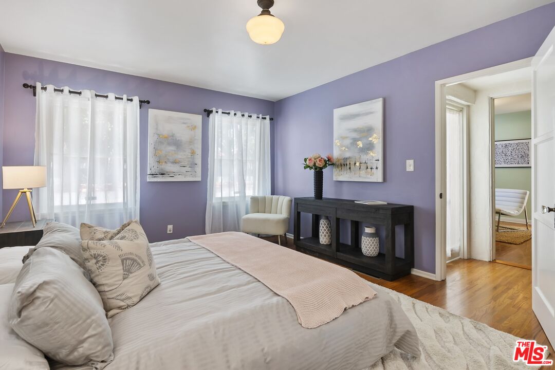 2303 Midvale Avenue Los Angeles, CA 90064 - Photo 21 of 38 a bedroom with a bed and a fireplace