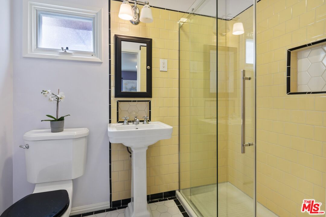 2303 Midvale Avenue Los Angeles, CA 90064 - Photo 22 of 38 a bathroom with a sink a toilet and shower