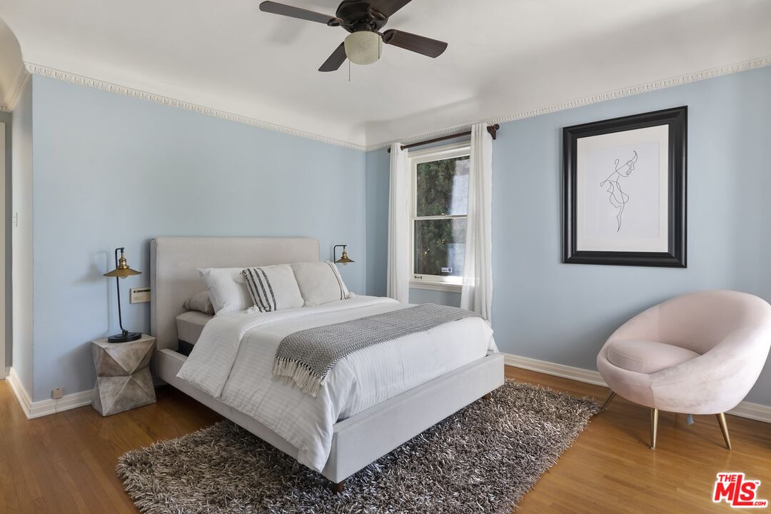 2303 Midvale Avenue Los Angeles, CA 90064 - Photo 24 of 38 a bedroom with a bed and a chair