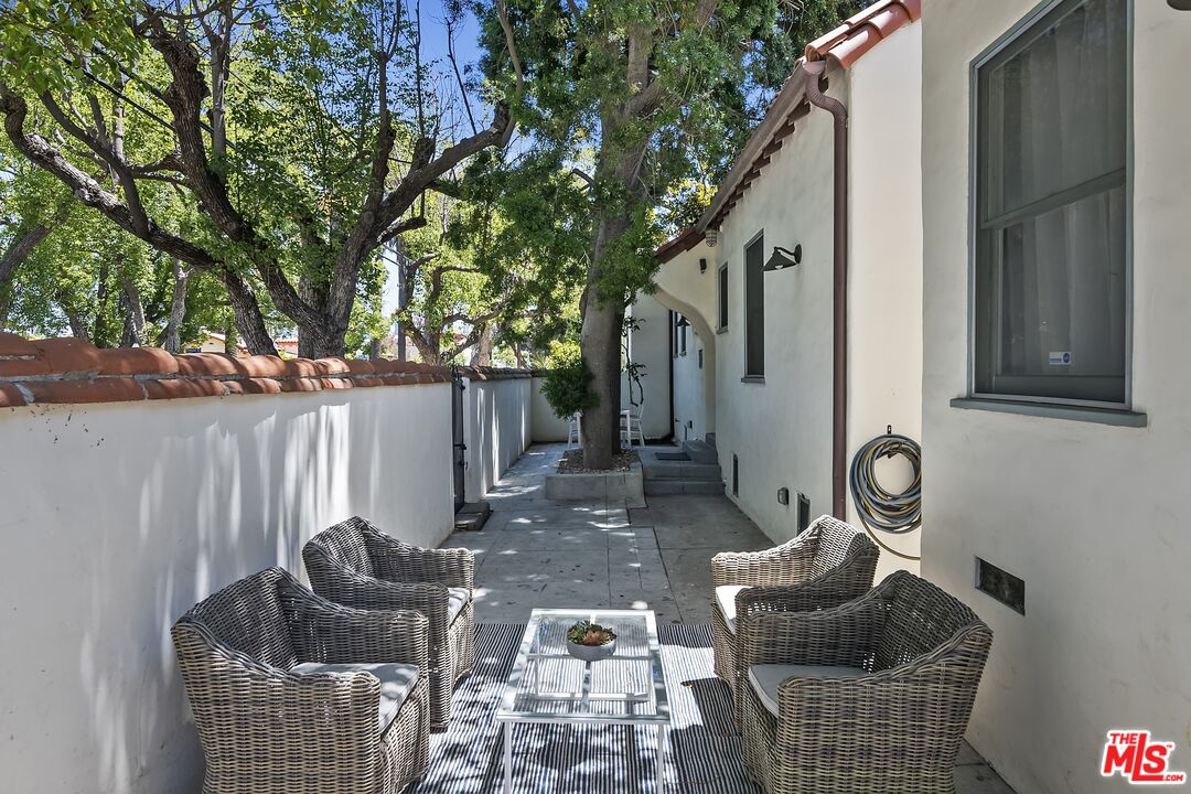 2303 Midvale Avenue Los Angeles, CA 90064 - Photo 35 of 38 a backyard of a house with outdoor seating