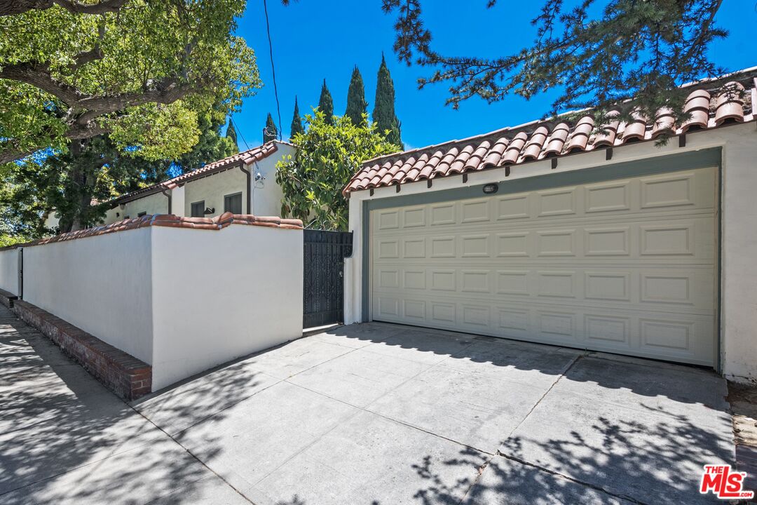 2303 Midvale Avenue Los Angeles, CA 90064 - Photo 38 of 38 a side view of a house with a garage