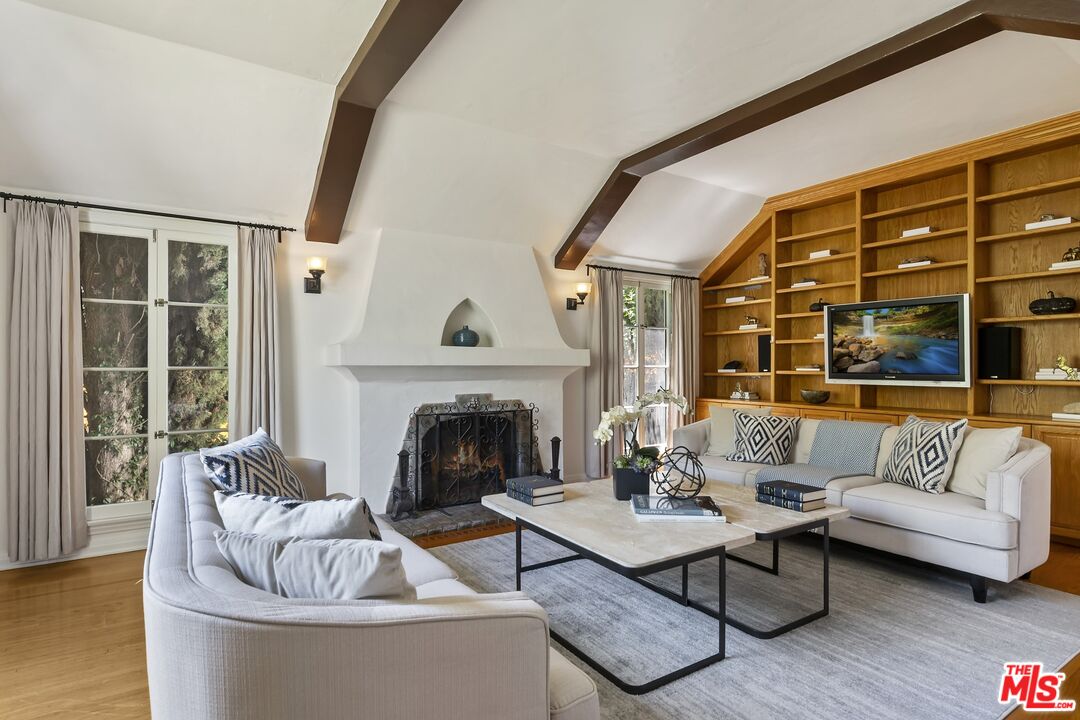 2303 Midvale Avenue Los Angeles, CA 90064 - Photo 7 of 38 a living room with furniture and a fireplace