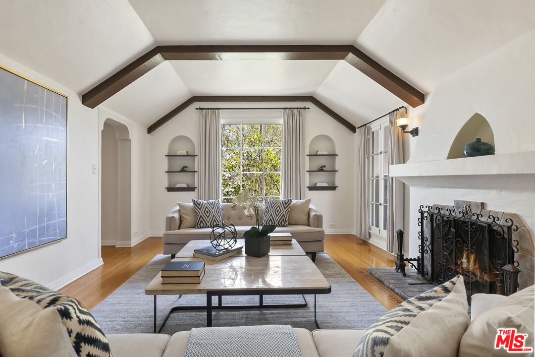 2303 Midvale Avenue Los Angeles, CA 90064 - Photo 10 of 38 a living room with furniture and a fireplace